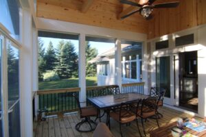 A patio screen room design by Signature Decks & Construction