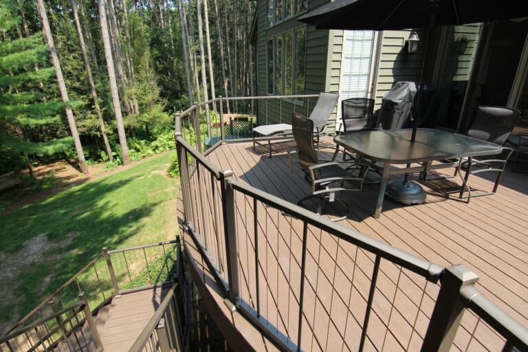 Deck Builder reviews are vital to Signature Decks growth. A stunning deck overlooking a lush woodland backyard.