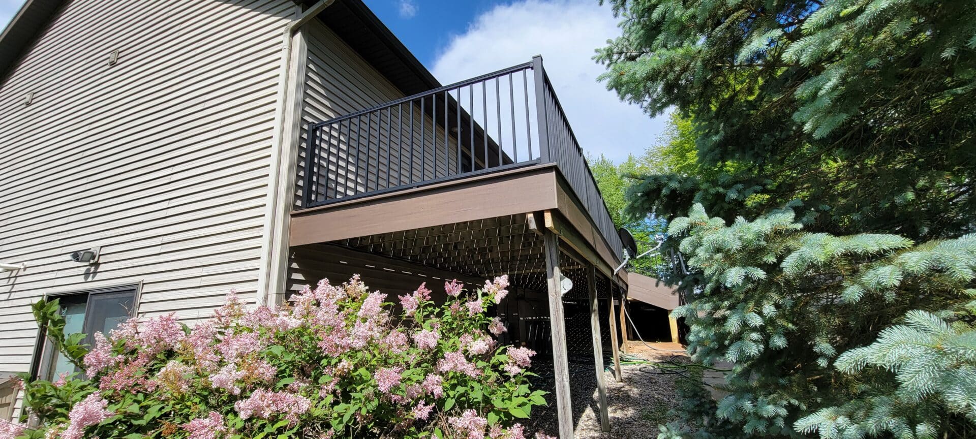 a custom balcony with fencing created by signature decks