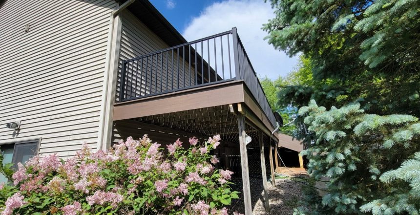 a custom balcony with fencing created by signature decks