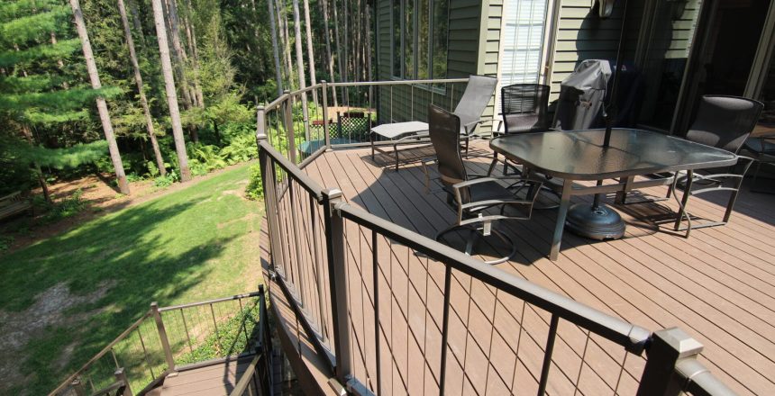 Deck Builder reviews are vital to Signature Decks growth. A stunning deck overlooking a lush woodland backyard.